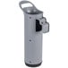 A grey plastic Unger toilet bowl brush with a black rubber base and handle in a holder.