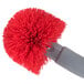 A red and grey Unger Ergo toilet bowl brush with a handle.
