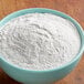 A bowl of Goya enriched rice flour on a wooden table.