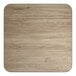 A square, reversible laminated table top with a white birch and ash wood grain finish.