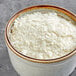 A bowl of Idahoan mashed potato flakes with a brown rim.