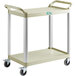 A beige plastic utility cart with wheels and two shelves.