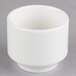 A Homer Laughlin bright white china bouillon bowl on a gray surface.