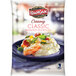 A white and blue bag of Idahoan Creamy Classic Mashed Potatoes.