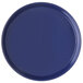 A blue round Carlisle melamine serving tray with a rim.
