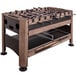 A Triumph 4-in-1 swivel game table with a foosball top on a metal stand.