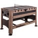 A Triumph 4-in-1 Swivel Game Table with ping pong rackets on it.