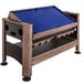 A Triumph 4-in-1 game table with a blue cloth on top.