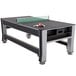 a ping pong table with a racket and balls