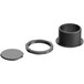 A close-up of a Lancaster Table & Seating black plastic round cap with a hole in it.