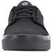 A black Shoes For Crews Merlin unisex shoe with laces and a rubber sole.