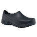 A pair of black Shoes For Crews non-slip work shoes with rubber soles.