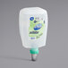 A white and green plastic container of Dial FIT Universal Touch-Free Antibacterial Hand Sanitizer refill.