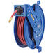 A blue Coxreels hose reel with a red hose.