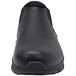 A black Shoes for Crews Cater II non-slip shoe with a rubber sole.