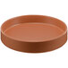 A brown round Cal-Mil melamine plate with a raised rim.