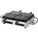 A close up of a Hatco Brussels style double Belgian waffle maker with four square plates.