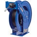 a blue hose reel with a hose attached