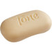 A white Dial Tone bar soap with text engraved on it.