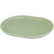 A white oval melamine platter with a raised rim.