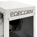 A white Paragon popcorn machine with black text.