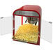 A red and white Paragon Diner Pop popcorn machine with popcorn inside.