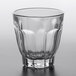 An Arcoroc Arcadie Rocks glass with a curved rim on a white background.