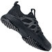 A black Shoes For Crews Heather II athletic shoe with a white sole.