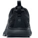 The back of a black Shoes For Crews Heather II athletic shoe with a logo.