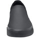A black Shoes For Crews Ollie II non-slip shoe with a black rubber sole.