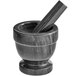 A black marble Fox Run mortar and pestle.