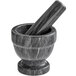 A Fox Run black marble mortar and pestle set.