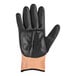 A pair of black and orange Mercer Culinary Millennia food processing gloves.