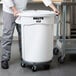 a person pushing a large white container