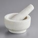 A white marble Fox Run mortar and pestle set.