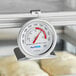 An AvaTemp hot holding thermometer on a rack.