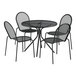 A Lancaster Table & Seating Harbor black metal table and 4 chairs on an outdoor patio.