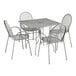 A Lancaster Table & Seating Harbor Gray square outdoor table with ornate legs and four arm chairs.