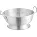 a silver colander with holes