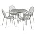 A Lancaster Table & Seating Harbor Gray 36" Round Outdoor Table and Chair Set with Ornate Metal Legs.