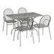 A Lancaster Table & Seating outdoor table with modern legs and chairs on a patio.