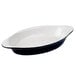 A black and eggshell oval shaped Tuxton rarebit dish.