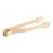 A pair of Thunder Group beige flat grip tongs with white handles.