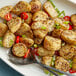A plate of potatoes seasoned with Regal Salt, Pepper, and Garlic Seasoning Blend.
