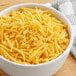 a bowl of shredded cheese