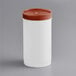 A white container with a brown lid.