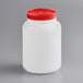 A white container with a red lid.