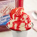 A cup of frozen yogurt with J. Hungerford Smith Fiesta Strawberry Puree
