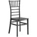 A black Lancaster Table & Seating resin chiavari chair.