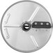 A circular metal Nemco julienne cutting disc with a hole in the center.